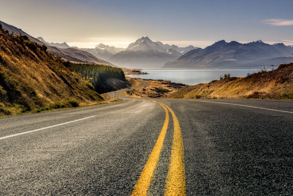 Image of a road with a mountain in the distance