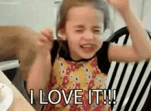 'I love it' young girl gif. She's showing excitement