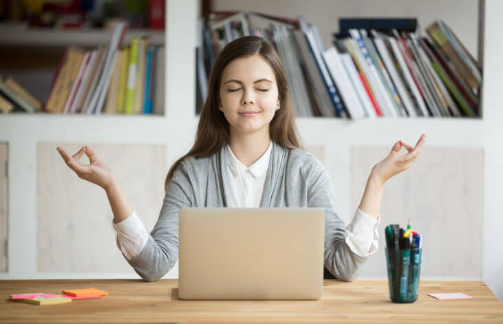 woman meditating at work