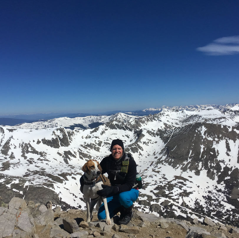Pete and his dog on a 14er